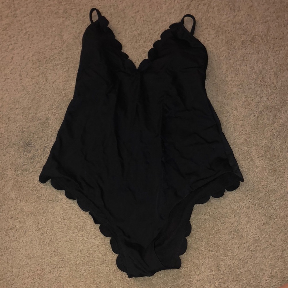 Black one piece bathing suit with eyelet wave trim